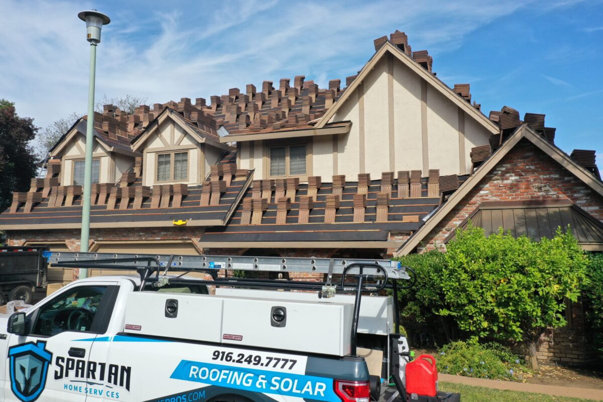 roofing lincoln ca branded truck parked outside of house under construction