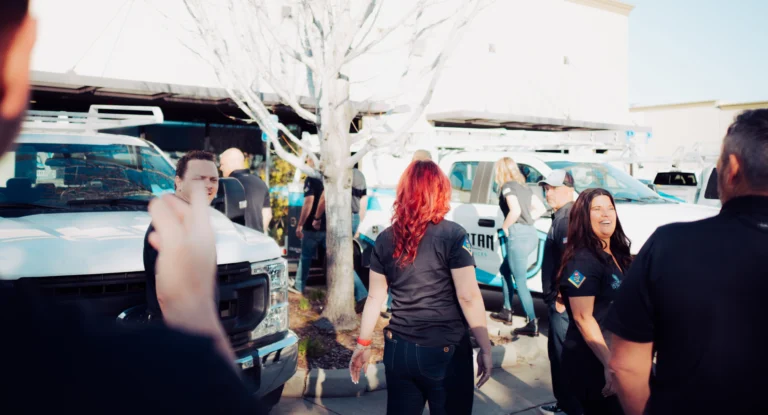 spartan-team-talking-in-parking-lot