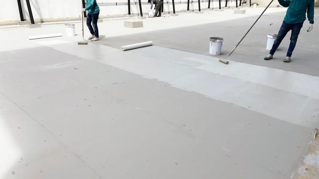 commercial roof coatings workers applying new coat