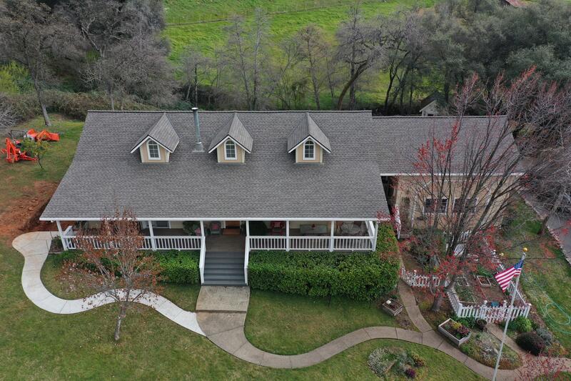 Completed gray shingle roof covered by a roof repair warranty in California