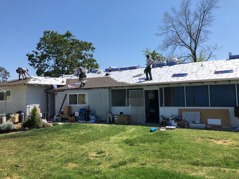 Roofers working on a house roof during roof repair in Citrus Heights CA
